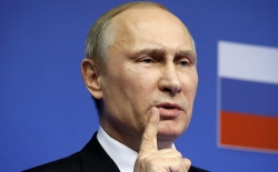 Russian President Putin speaks at a news conference after an EU-Russia Summit in Brussels